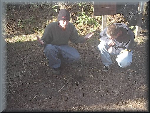 Mike and Ryan look at what was left by their tent.