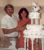 Mom and dad cutting the cake at their 25 surprise wedding anniversary